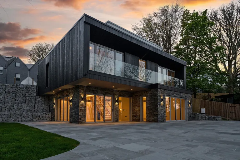 Timber-clad new build at dusk